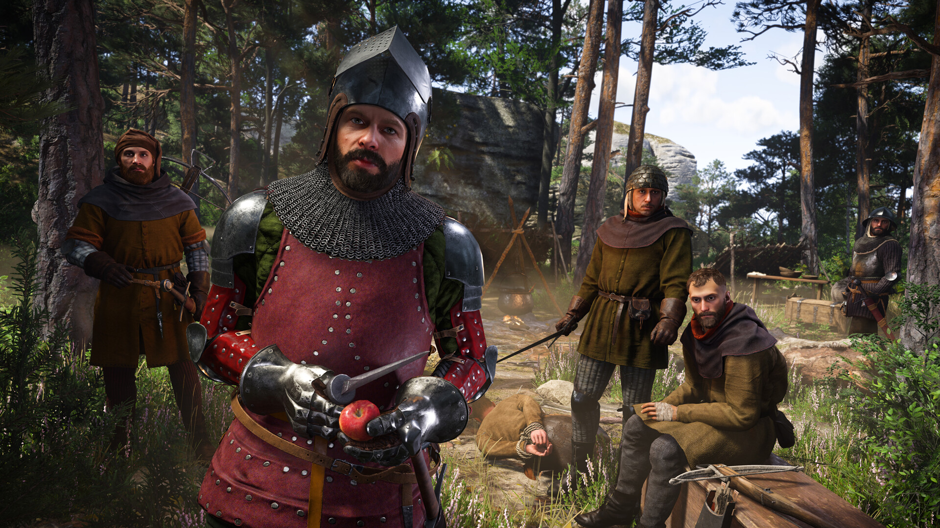 Capture d'écran officielle de Kingdom Come Deliverance 2 montrant Henry entouré de compagnons en forét